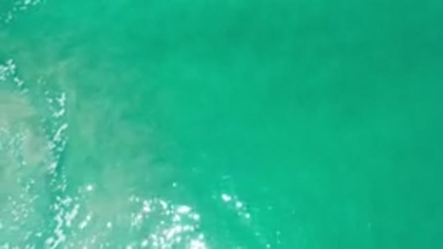 LOS CABOS MEXICO-2020: Aerial Footage Of Greenish Blue Water With A Still Camera