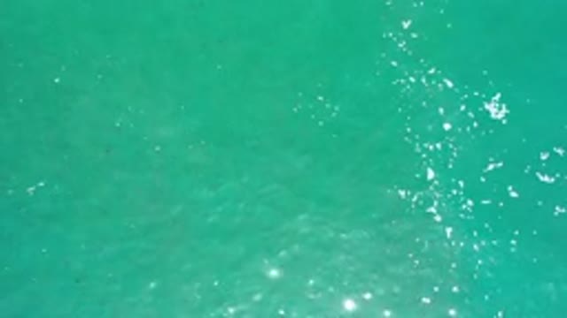 LOS CABOS MEXICO-2020: Aerial Footage Of Greenish Blue Water With A Slight Ripple