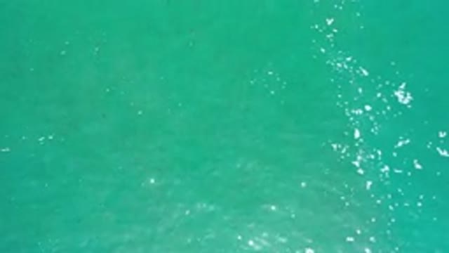 LOS CABOS MEXICO-2020: Turquoise Sea Flown Over By Drone With A Big Light Sun