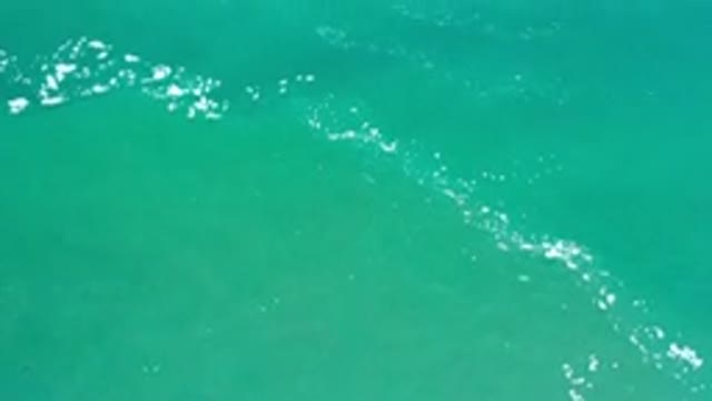 LOS CABOS MEXICO-2020: Drone View Of A Yacht In Green Waters With Little Waves