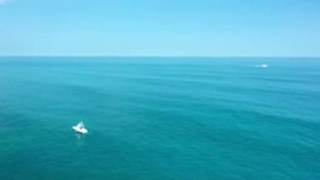 LOS CABOS MEXICO-2020: Small Boats On Crystal Clear Green Seas Near The Shore