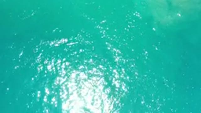 LOS CABOS MEXICO-2020: Turquoise Greenish Water With Sun Reflecting Off Of