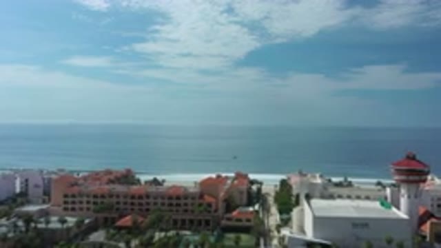 LOS CABOS MEXICO-2020: Vast Ocean Beyond City Buildings Under Blue Sky