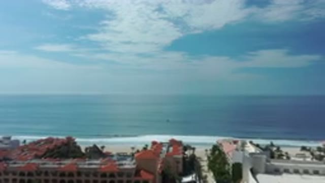 LOS CABOS MEXICO-2020: Aerial View of Ocean Waves Near a Coastal City