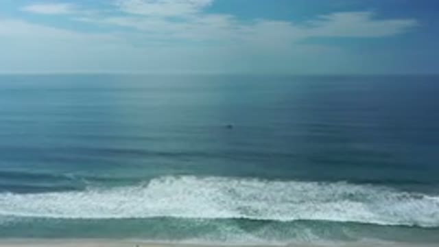 LOS CABOS MEXICO-2020: Beautiful Shot Of The Dark Ocean Waves Under A Big Blue