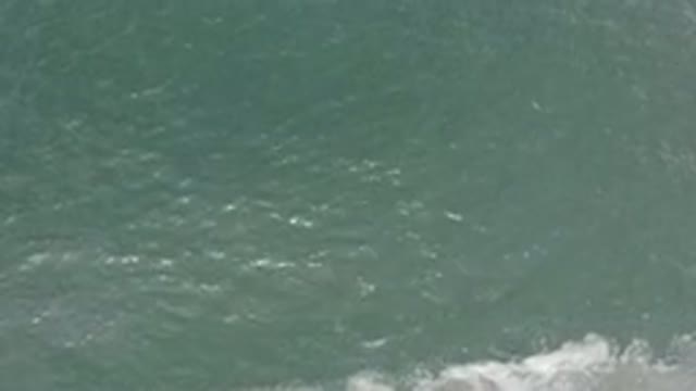 LOS CABOS MEXICO-2020: Waves Moving Towards And Away From A Sunny Unseen Beach