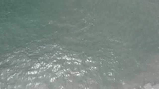 LOS CABOS MEXICO-2020: Drone Shot Of The Clean And Clear Gray Ocean Waves