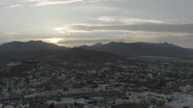 LOS CABOS MEXICO-2020: An Aerial View Of The Sun Peeking Out From Behind The