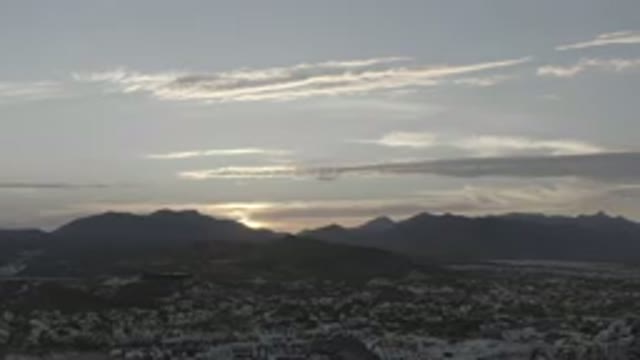 LOS CABOS MEXICO-2020: Sunset Over Mountains With Some Snow In The Foreground