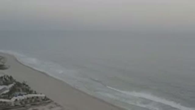 LOS CABOS MEXICO-2020: Waves Crashing On The Shore Of An Ocean On A Cloudy Day