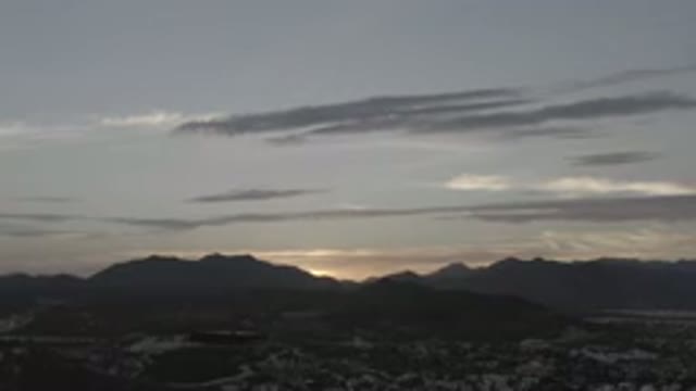 LOS CABOS MEXICO-2020: Evening Sky As The Sun Disappears Behind The Mountain