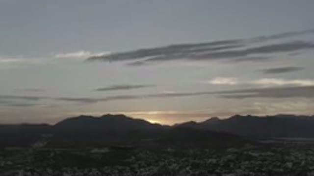 LOS CABOS MEXICO-2020: Sun Rising From Behind Mountains And Rocks With Dark