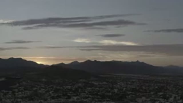 LOS CABOS MEXICO-2020: Large Mountain Silhouette Surrounding Quiet Desert At Sunrise