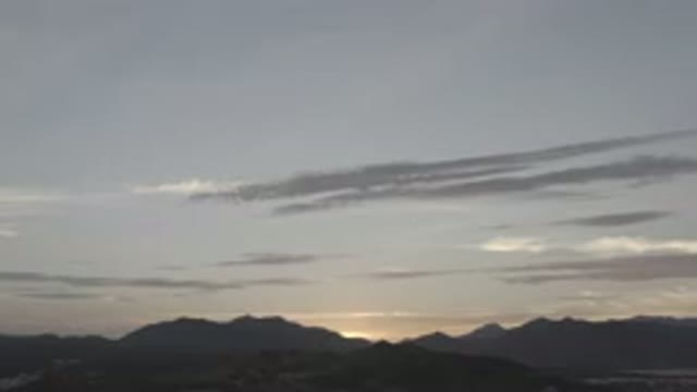 LOS CABOS MEXICO-2020: Hills Mountains Sunrise Gray And White Clouds On A Light