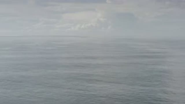 LOS CABOS MEXICO-2020: Calm Sea With Cloudy And Foggy Sky No Visible Horizon Or