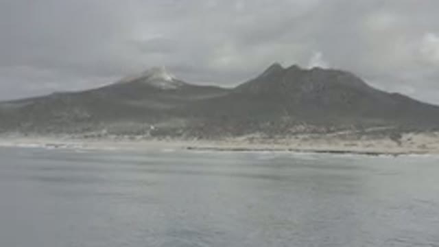 LOS CABOS MEXICO-2020: Two Large Mountains Near The Water Side