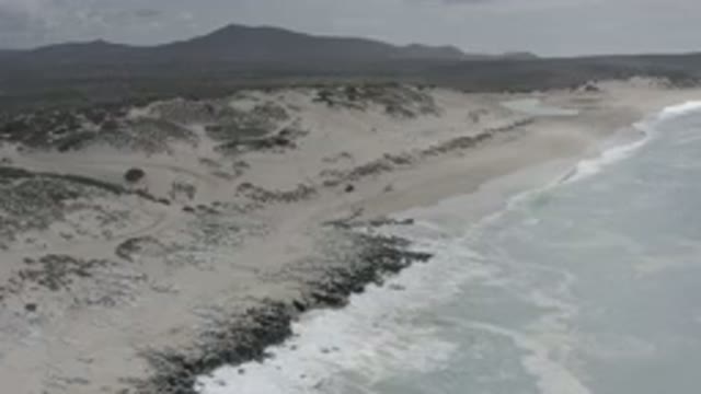 LOS CABOS MEXICO-2020: A Panning View Of A Stunning Coastal Line With Crashing Waves