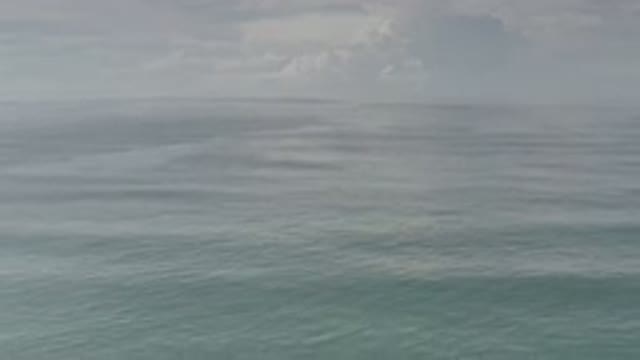 LOS CABOS MEXICO-2020: Endless Ocean With Small Waves And Clouds In The Distance