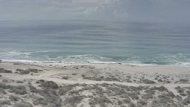 LOS CABOS MEXICO-2020: A Helicopter View Spanning The Shoreline Of The Ocean On
