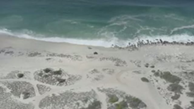 LOS CABOS MEXICO-2020: Panning Shot Of The Clear Ocean Waves Crashing Against