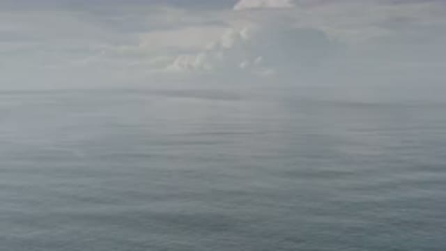 LOS CABOS MEXICO-2020: Drone Shot Of The Clean Ocean Waves Underneath The Sky