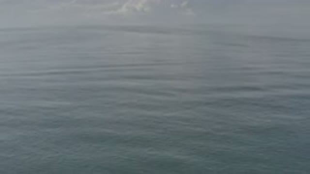 LOS CABOS MEXICO-2020: Water With Small Tides And White Clouds