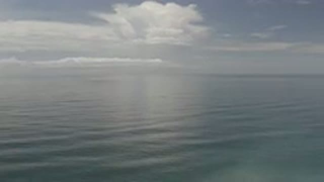 LOS CABOS MEXICO-2020: Slow Moving Tropical Body Of Water With Few Clouds In The Sky