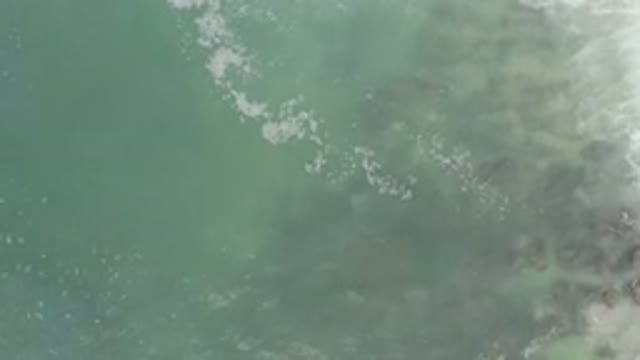 LOS CABOS MEXICO-2020: Ocean Waves Overhead View Scroll