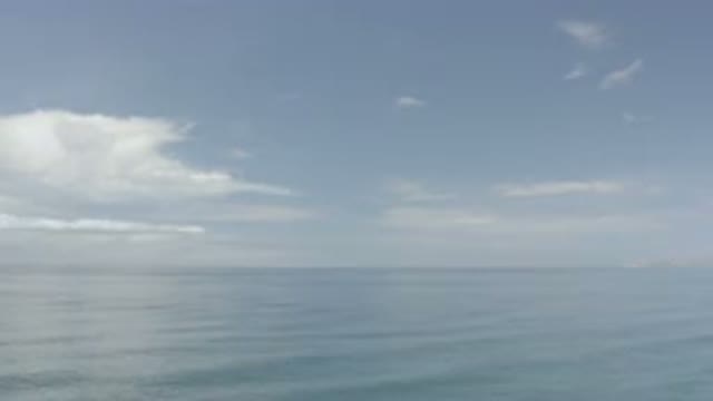 LOS CABOS MEXICO-2020: Overlooking Calm Waters With Clouds And Shoreline In The