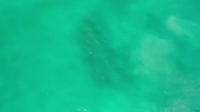 LOS CABOS MEXICO-2020: Aquamarine Water Flows Over a Shallow Bottom With Patches