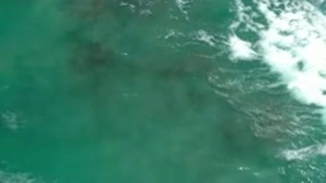 LOS CABOS MEXICO-2020: Wave Quickly Moves Across Coral Reef Creating A Beautiful