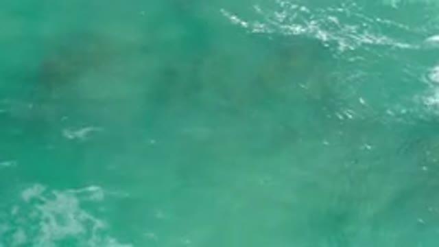 LOS CABOS MEXICO-2020: Aquamarine Waves With White Peaks Ebbing And Flowing Over Rocks