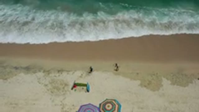 LOS CABOS MEXICO-2020: Top View Of Two Kids Playing On Beach Sand