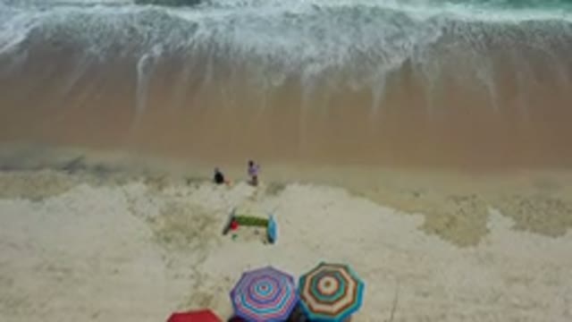 LOS CABOS MEXICO-2020: Kids Stand On The Shores As Ocean Waves Crash