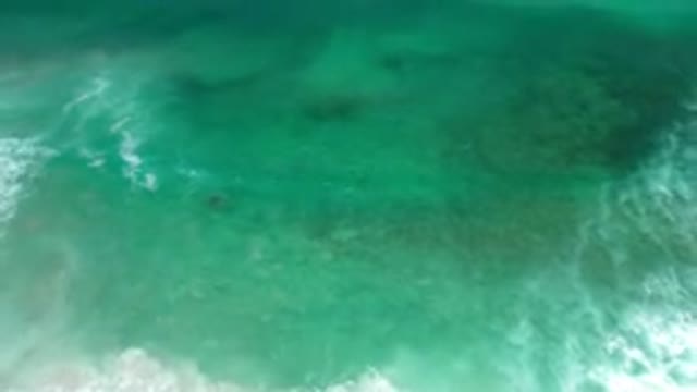 LOS CABOS MEXICO-2020: Aqua Green Waves With Streaks Of White Foam In A Rolling