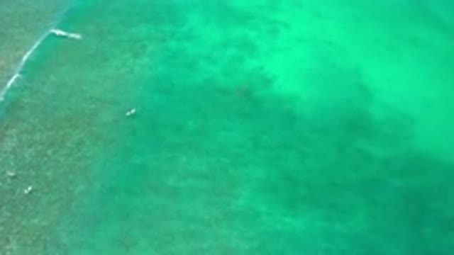 LOS CABOS MEXICO-2020: Overhead Shot Of A Wave Running Across The Water