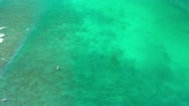 LOS CABOS MEXICO-2020: Boats Floating In The Ocean As A Wave Rolls Over The
