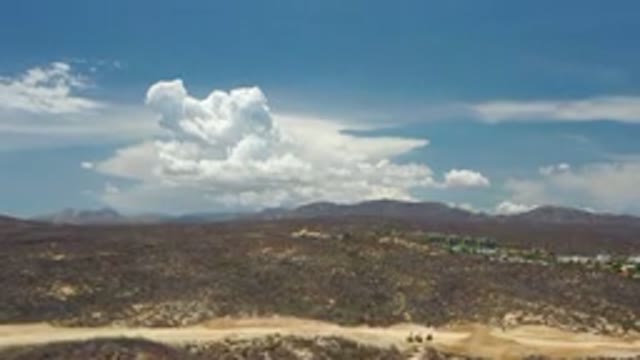 LOS CABOS MEXICO-2020: Overlooking A Desert With A Mountain Range In The Distance