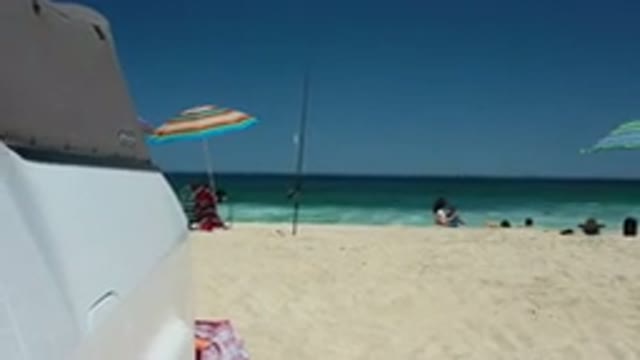 LOS CABOS MEXICO-2020: People Stand On A Beach Near The Waterline In Front Of