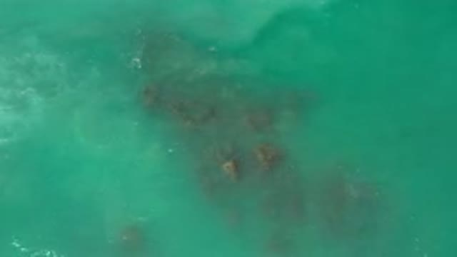 LOS CABOS MEXICO-2020: A Group Of Rocks In The Middle Of The Sea Being Hit By Waves