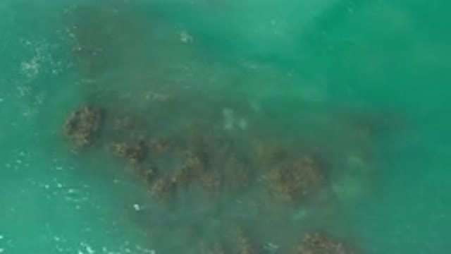 LOS CABOS MEXICO-2020: Sky View Of The Clean And Clear Green Ocean Waves Over