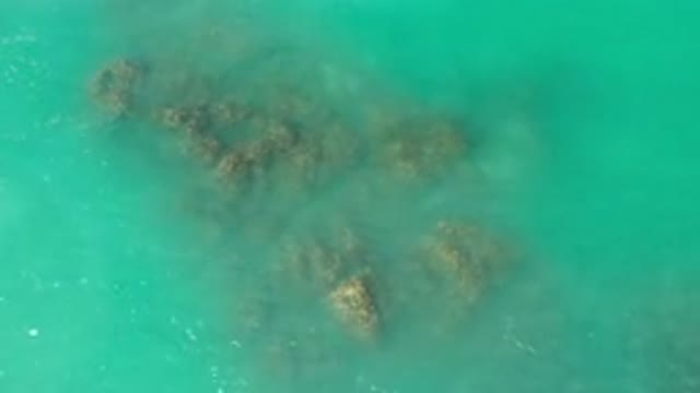 LOS CABOS MEXICO-2020: Water Rippling Over Rock In The Middle Of A Sea