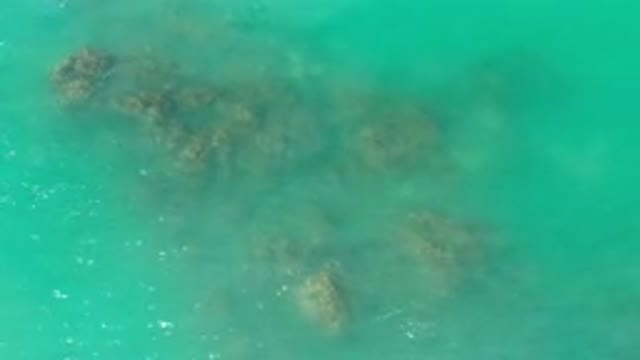 LOS CABOS MEXICO-2020: Clear Blue Water With Rocks In The Water With The Tips