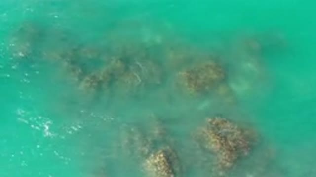 LOS CABOS MEXICO-2020: Blue Ocean Waves Crashing Foamy Over Rock Formation Day