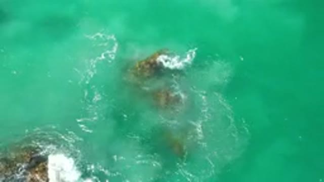 LOS CABOS MEXICO-2020: Blue Water Swirling and Creating Waves with Rocks