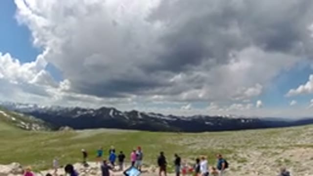 DENVER COLORADO-2019: People In The Mountains On A Plateau With High Winds