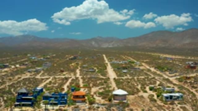 EL SARGENTO LA VENTANA MEXICO-2020: Flyover Of Vast Open Landscape With Mountains And Blue Sky