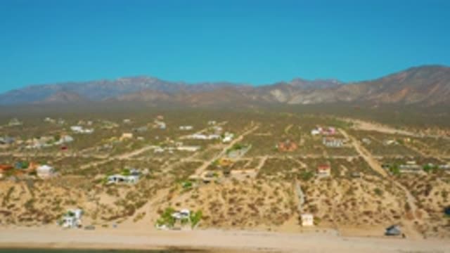 EL SARGENTO LA VENTANA MEXICO-2020: Zoom Over Desert With Houses Plants Roads
