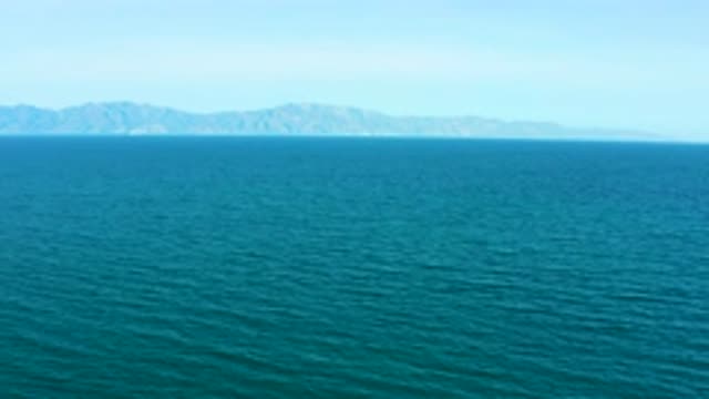 EL SARGENTO LA VENTANA MEXICO-2020: Vast Calm Ocean With A Mountainous Island In Distance