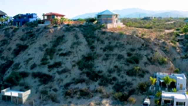 EL SARGENTO LA VENTANA MEXICO-2020: Large Colorful Houses Sit Atop A Grassy Hill